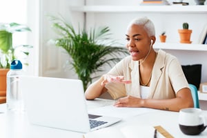 Woman at her laptop in a meeting