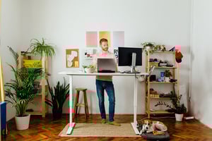 Person working from home on standing desk